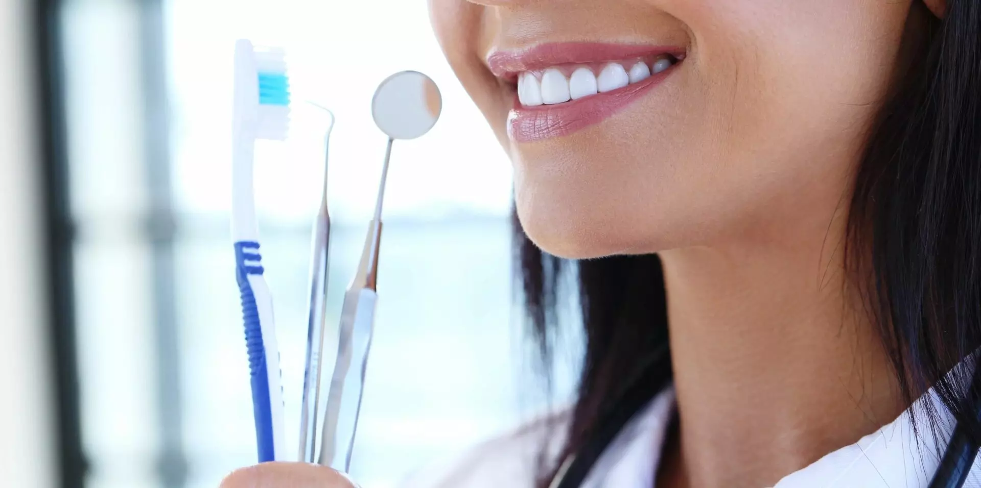 Woman holding dental tools